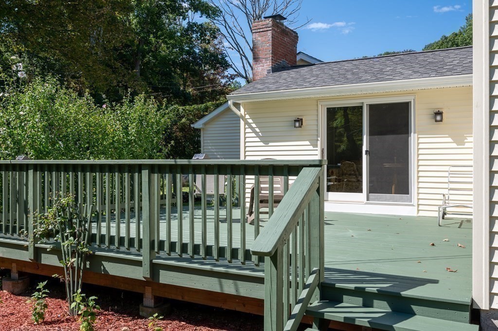 215 Stafford Road Holland, MA 01521 - Photo 9 of 36 a view of a house with a small yard and wooden fence