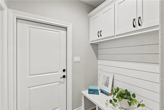 a kitchen with a sink and wooden floor