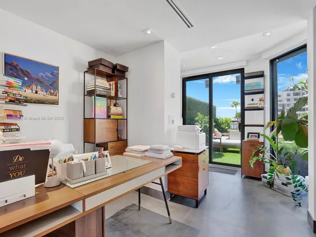 a view of a house with pool and chairs