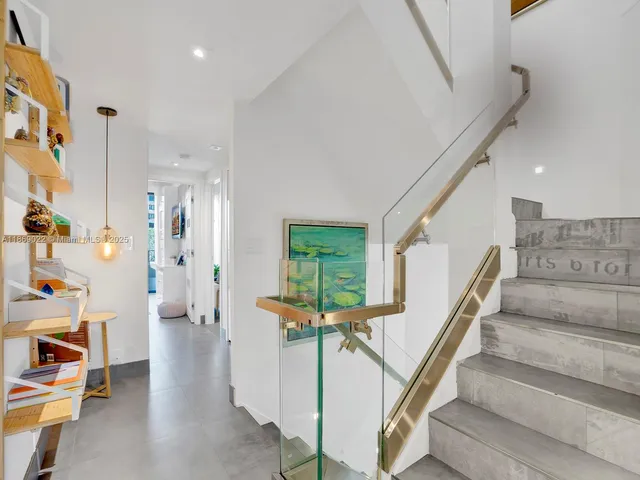 a bedroom with a bed and a table