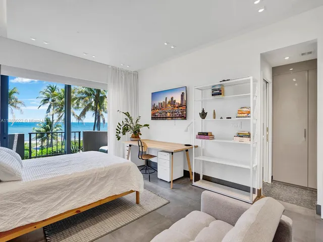 a bedroom with a bed and a bookshelf