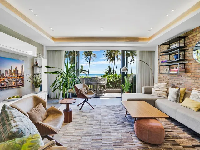 a view of a chair and tables in the balcony