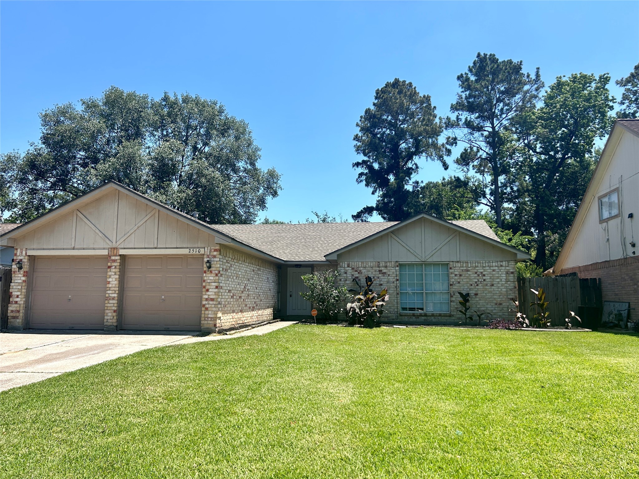 2510 Knollbrook Lane Spring, TX 77373 - Photo 4 of 24 a view of a yard in front of a house with large trees