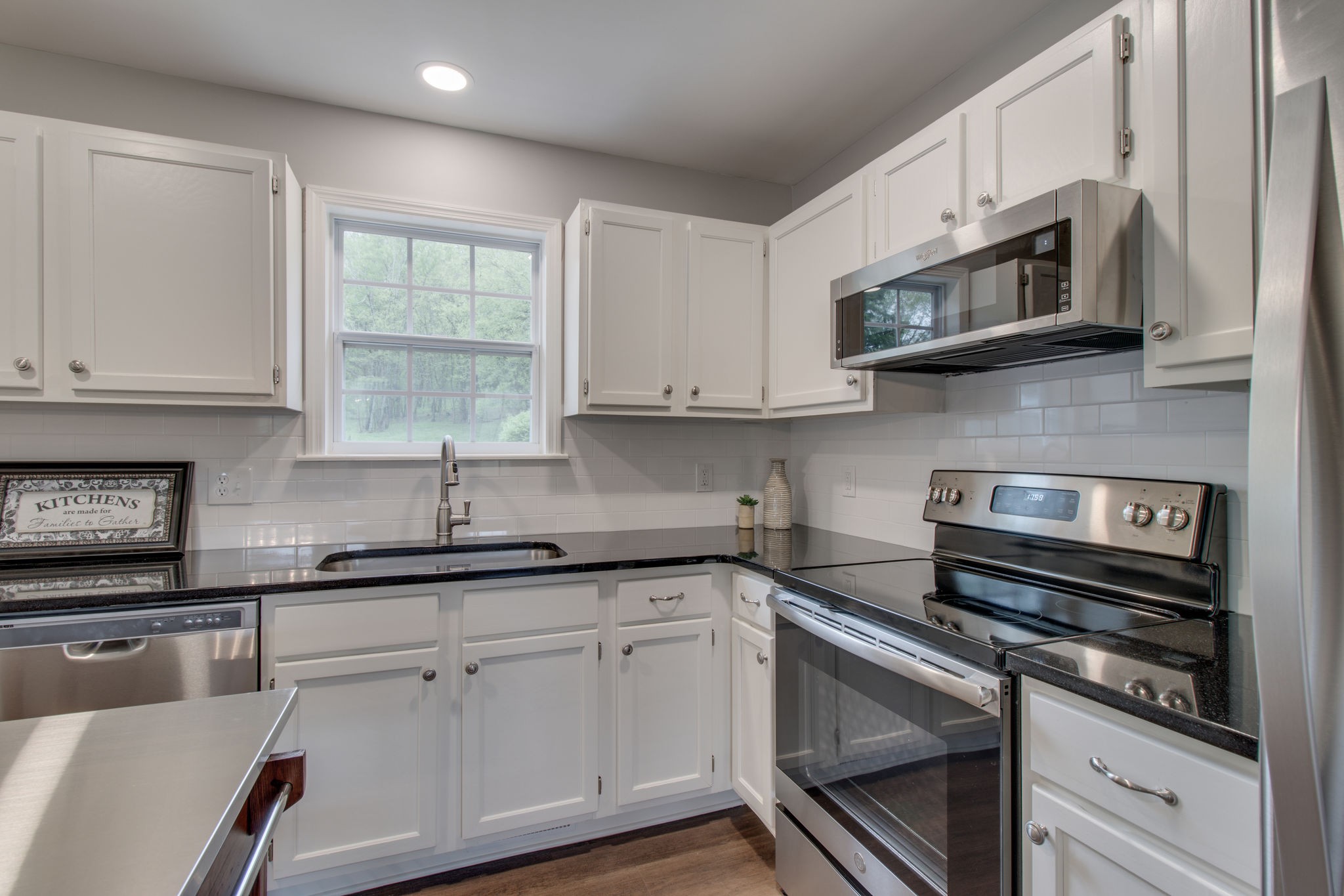 3990 Fairview Road Columbia, TN 38401 - Photo 11 of 29 a kitchen with stainless steel appliances granite countertop a sink a stove and a microwave