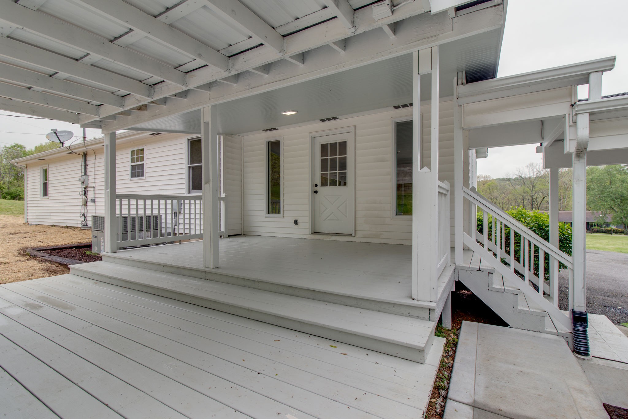 3990 Fairview Road Columbia, TN 38401 - Photo 26 of 29 a view of a porch with wooden floor and fence