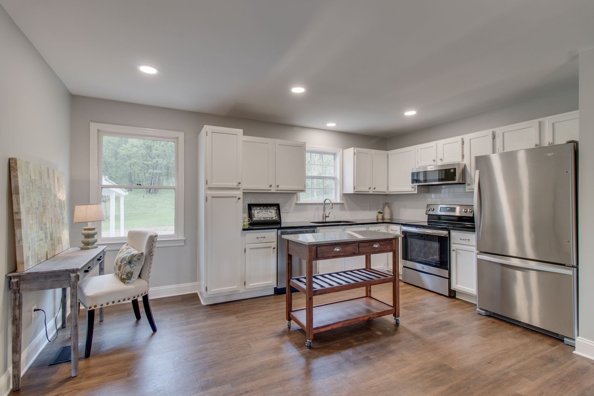 3990 Fairview Road Columbia, TN 38401 - Photo 7 of 29 a kitchen with refrigerator a table and chairs