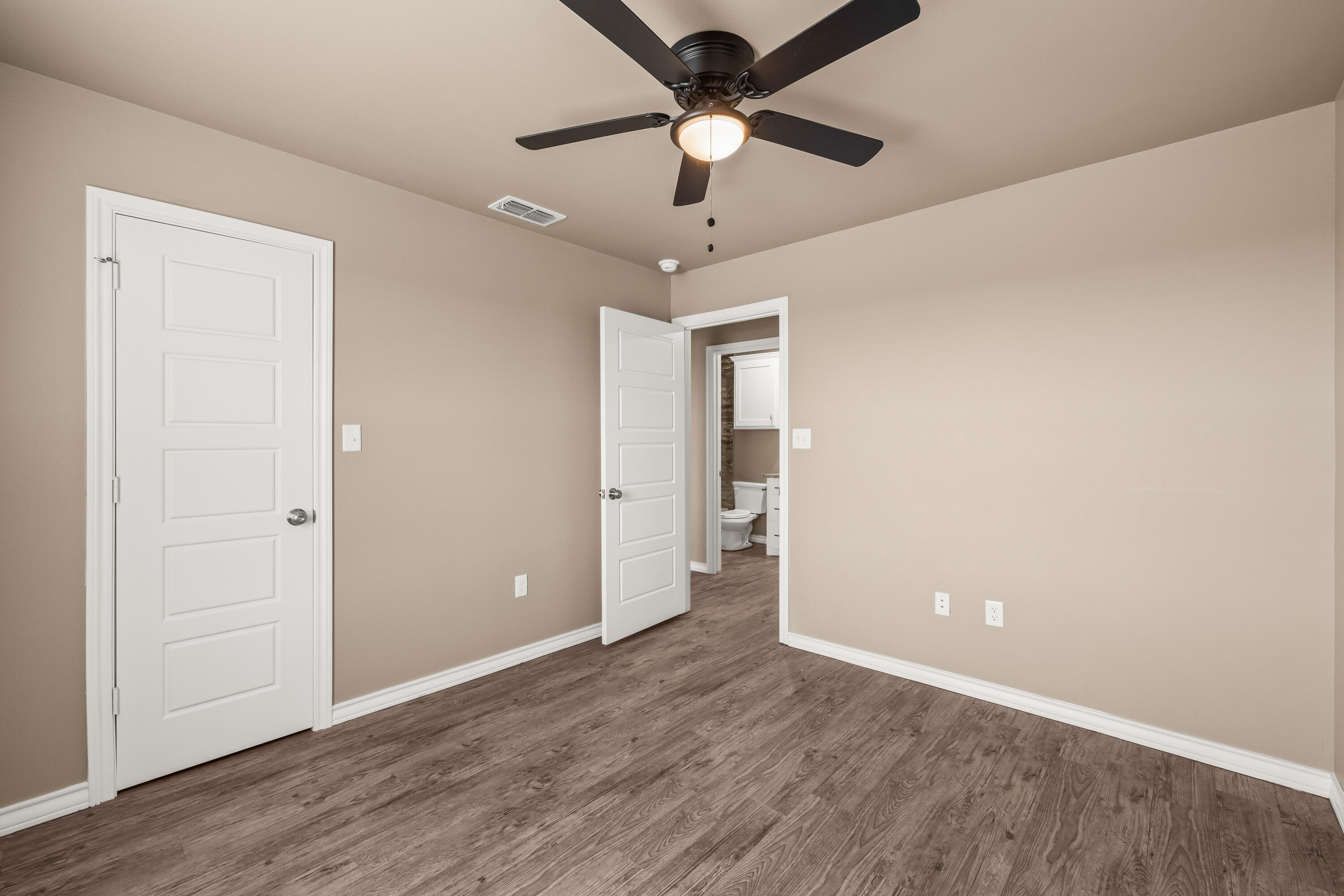 303 Ave L Abernathy, TX 79311 - Photo 18 of 21 wooden floor in an empty room with a window