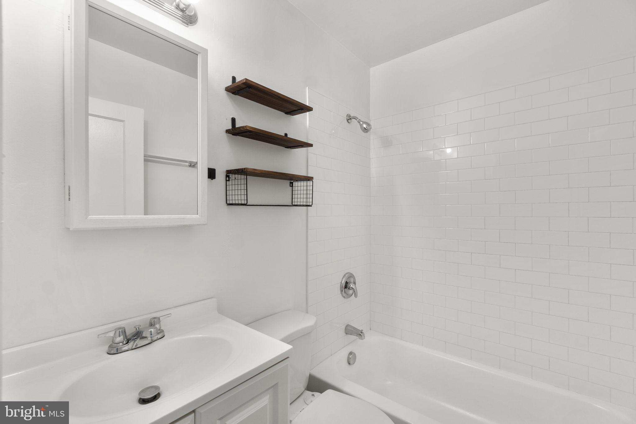 3658 Clifmar Road Baltimore, MD 21244 - Photo 22 of 43 a bathroom with a sink and a bathtub
