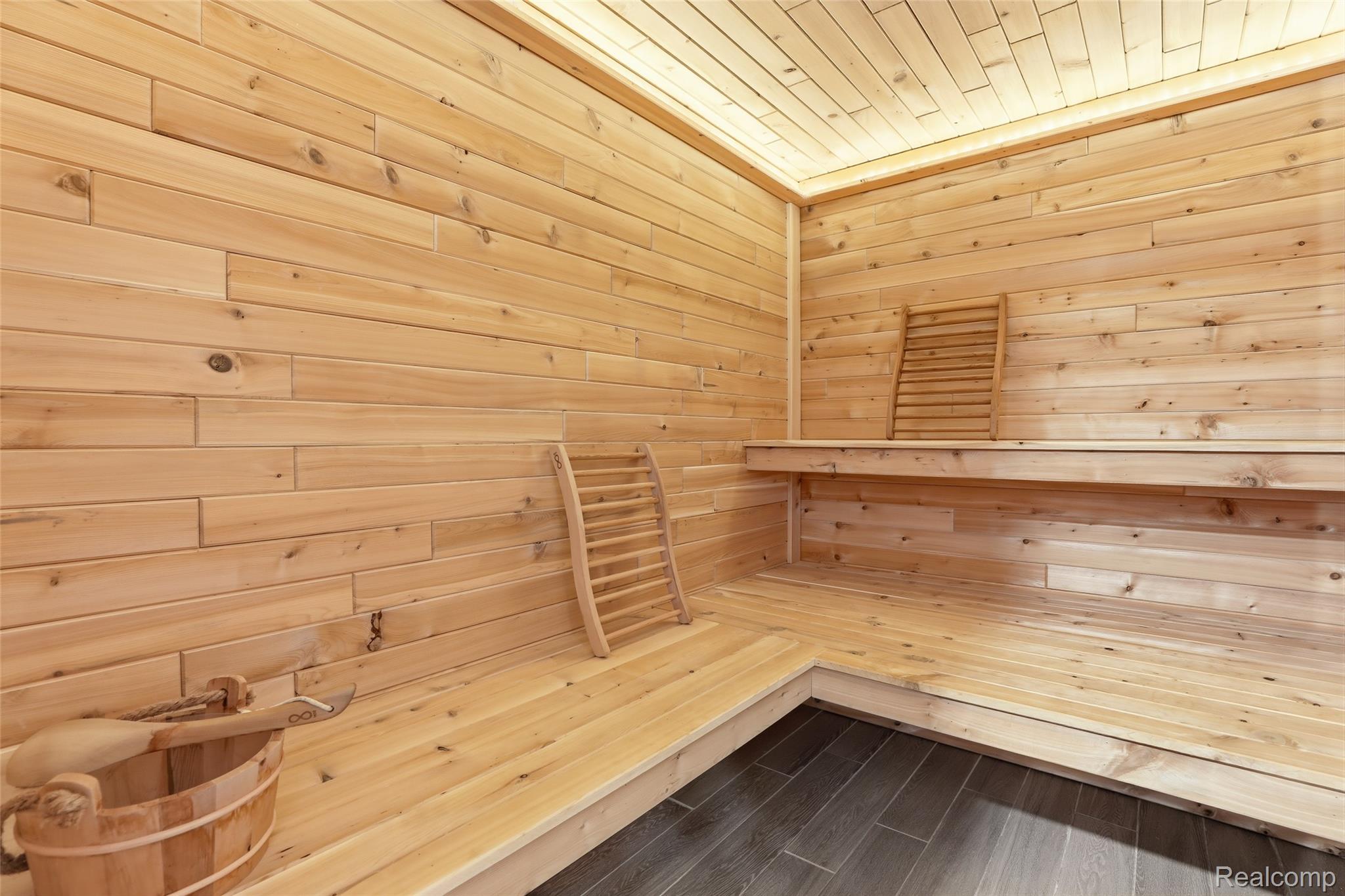 668 Springview Drive Rochester, MI 48307 - Photo 74 of 90 Relaxing sauna featuring wooden walls, wood ceiling, and wood finished floors