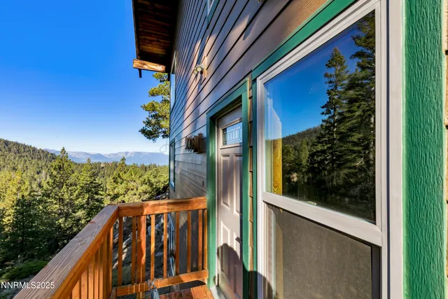 a view of balcony with wooden floor and fence