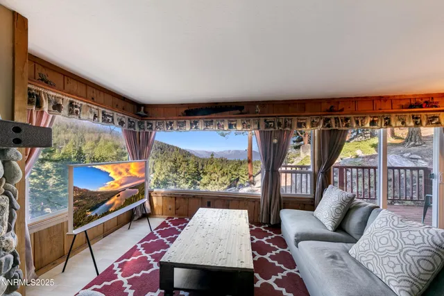 a living room with furniture and a rug