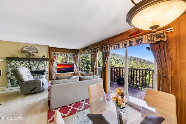 a living room with furniture a couch and a chandelier
