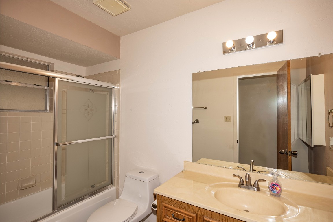 2501 Fischer Store Road Wimberley, TX 78676 - Photo 24 of 37 Full bath featuring combined bath / shower with glass door and vanity