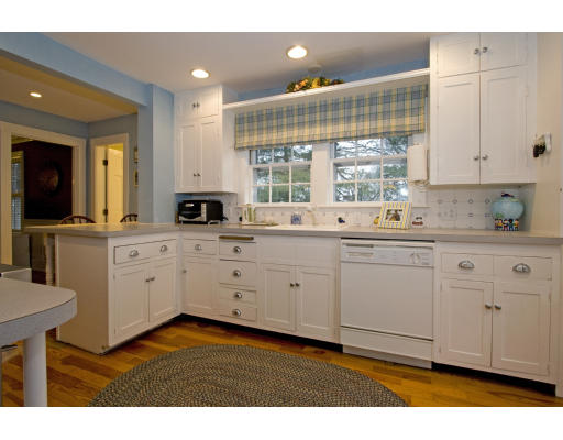 21 Ledyard Road Winchester, MA 01890 - Photo 5 of 16 a kitchen with a sink window and cabinets