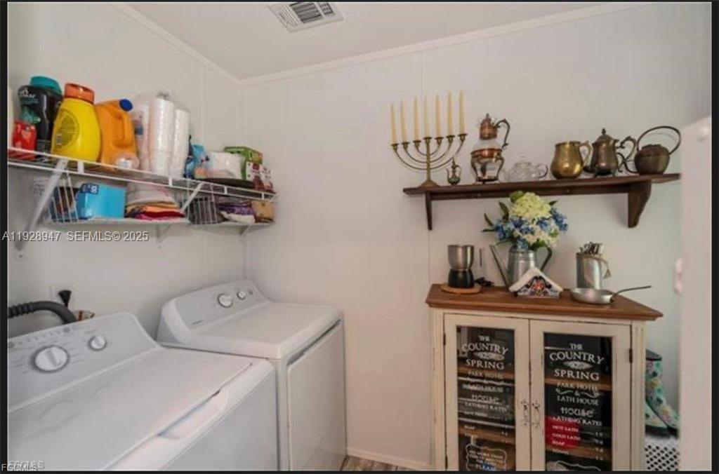 2638 Ortona Locks Road Moore Haven, FL 33471 - Photo 11 of 14 a view of storage and utility room with
