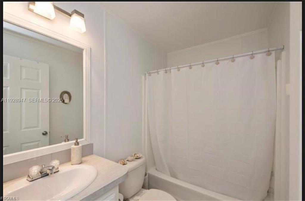 2638 Ortona Locks Road Moore Haven, FL 33471 - Photo 13 of 14 a bathroom with a sink toilet and shower