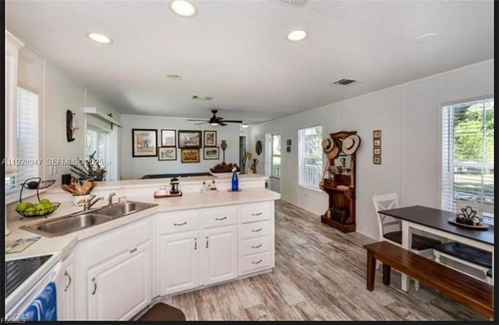 2638 Ortona Locks Road Moore Haven, FL 33471 - Photo 7 of 14 a spacious bathroom with double vanity and a mirror