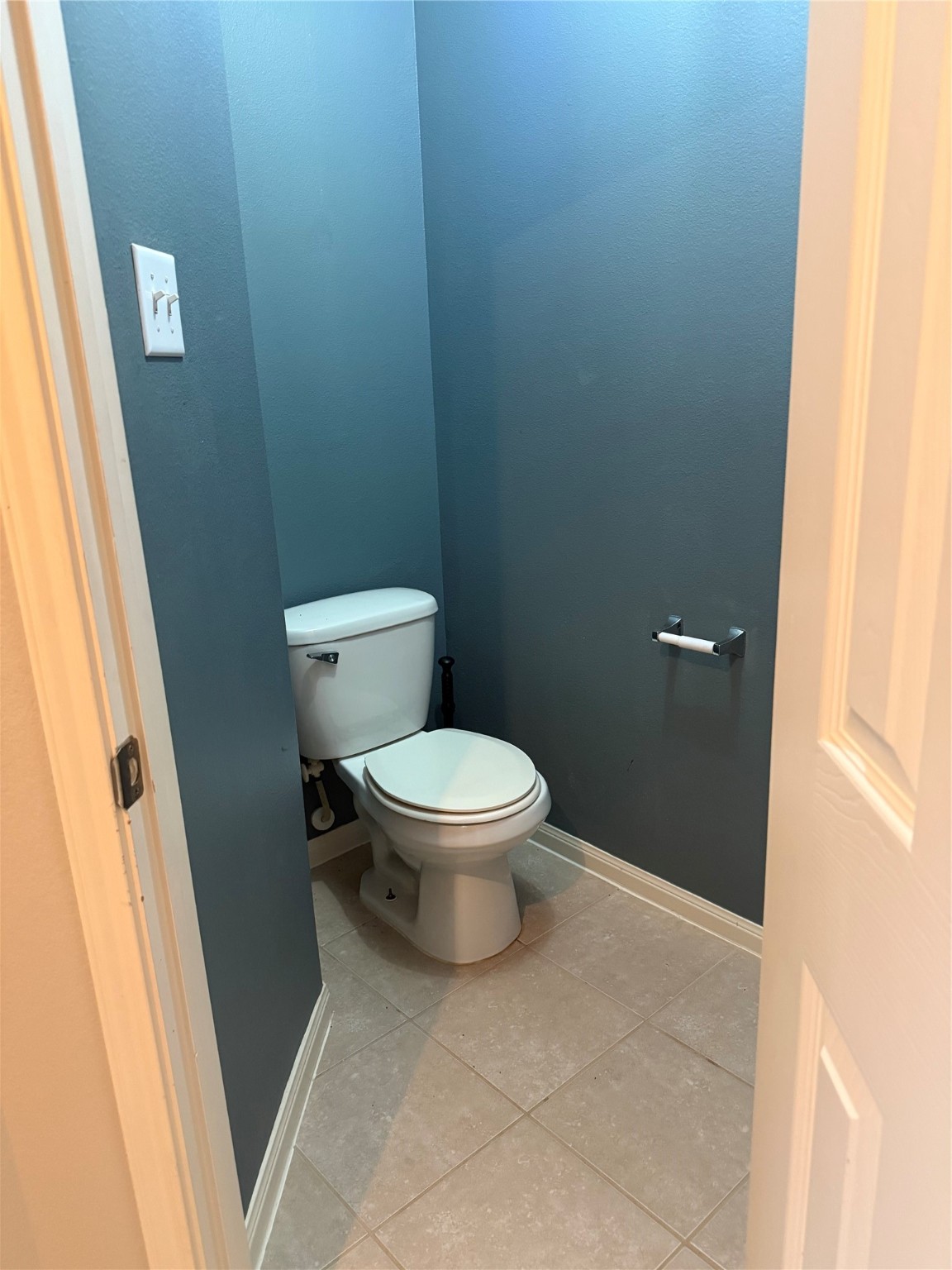 10208 Jewel Court Conroe, TX 77385 - Photo 13 of 23 a white toilet sitting next to a sink
