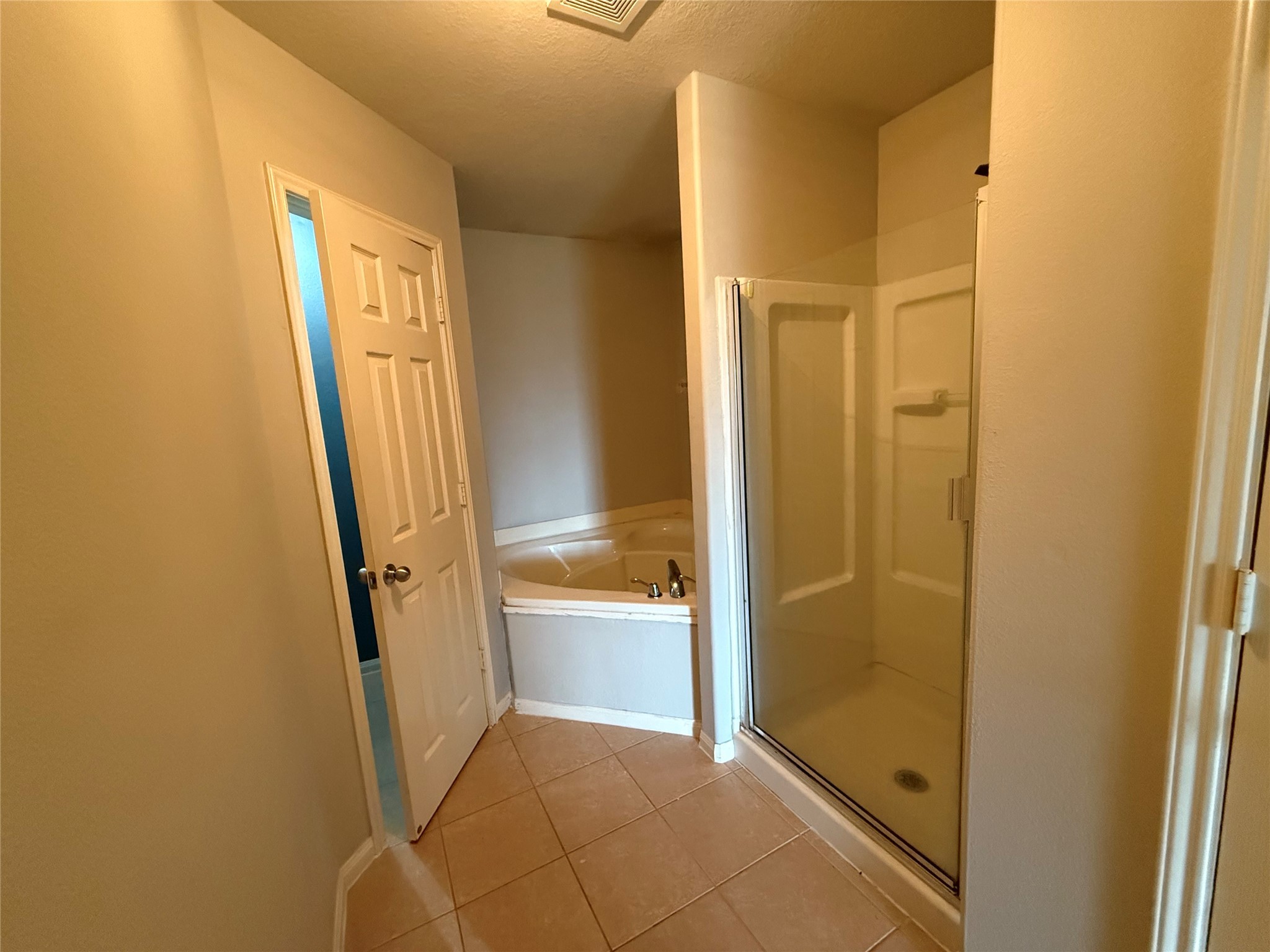 10208 Jewel Court Conroe, TX 77385 - Photo 14 of 23 a bathroom with a glass door shower