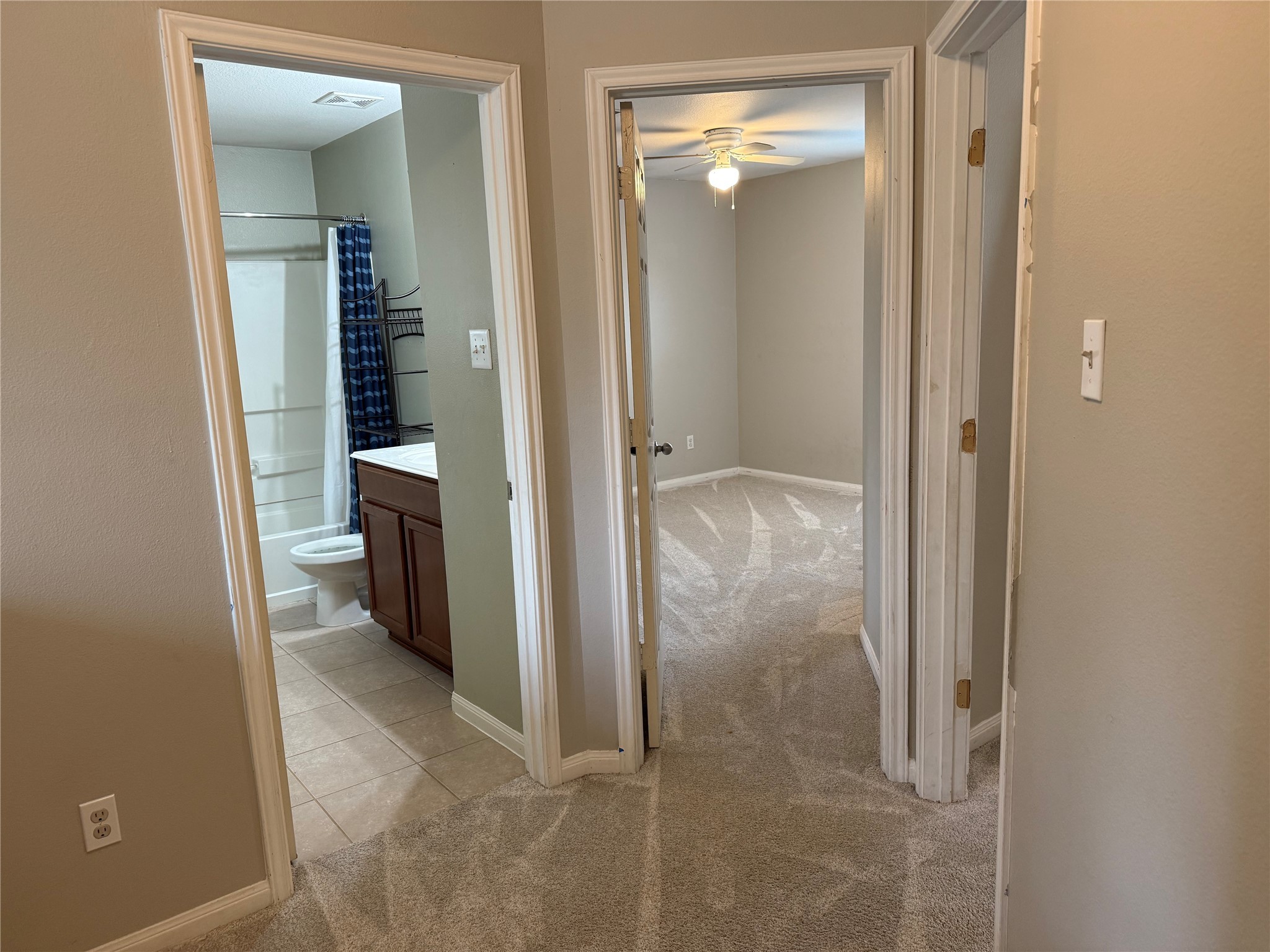 10208 Jewel Court Conroe, TX 77385 - Photo 16 of 23 an empty room and a bathroom with a mirror