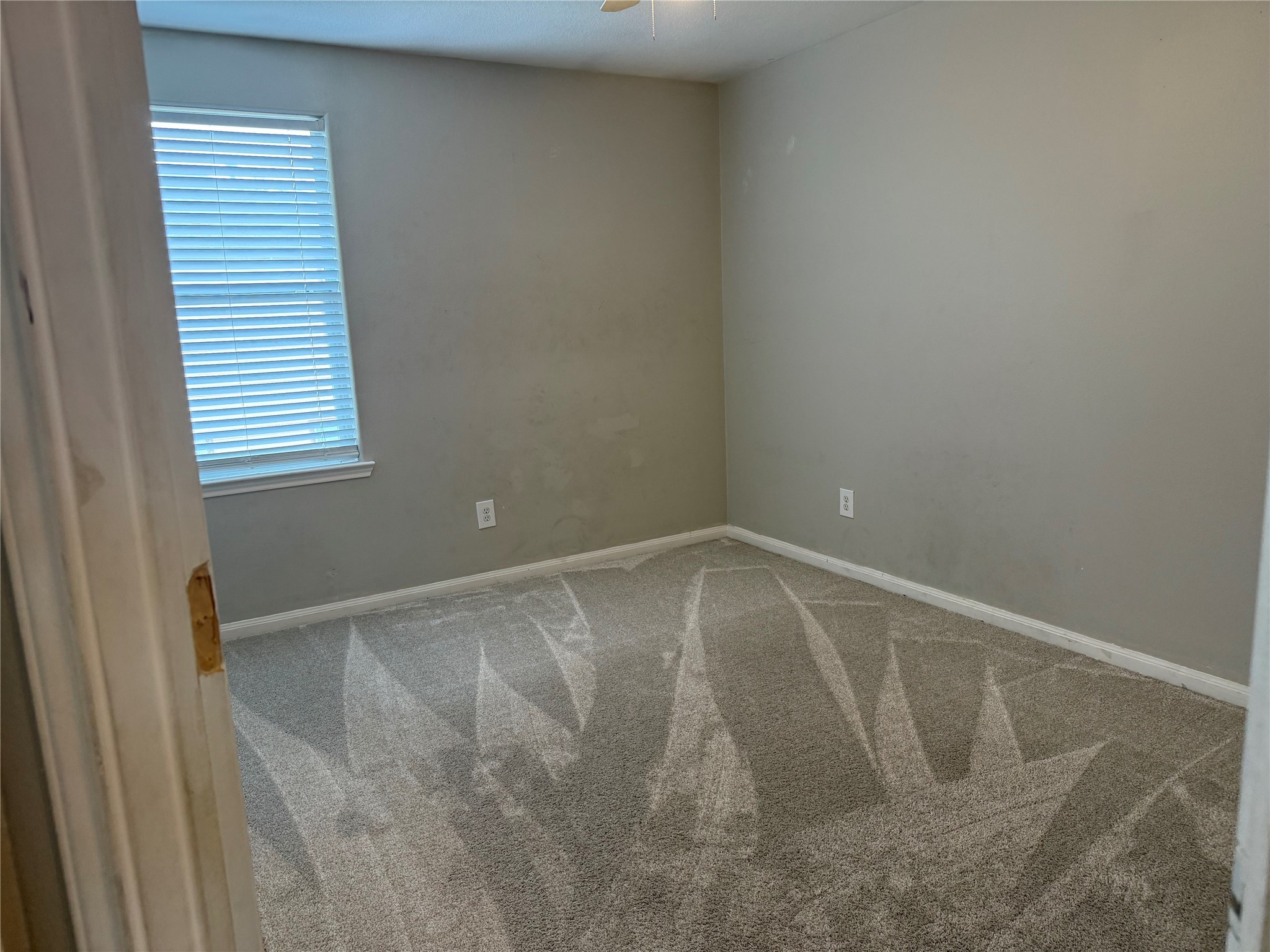 10208 Jewel Court Conroe, TX 77385 - Photo 20 of 23 a view of an empty room with a window