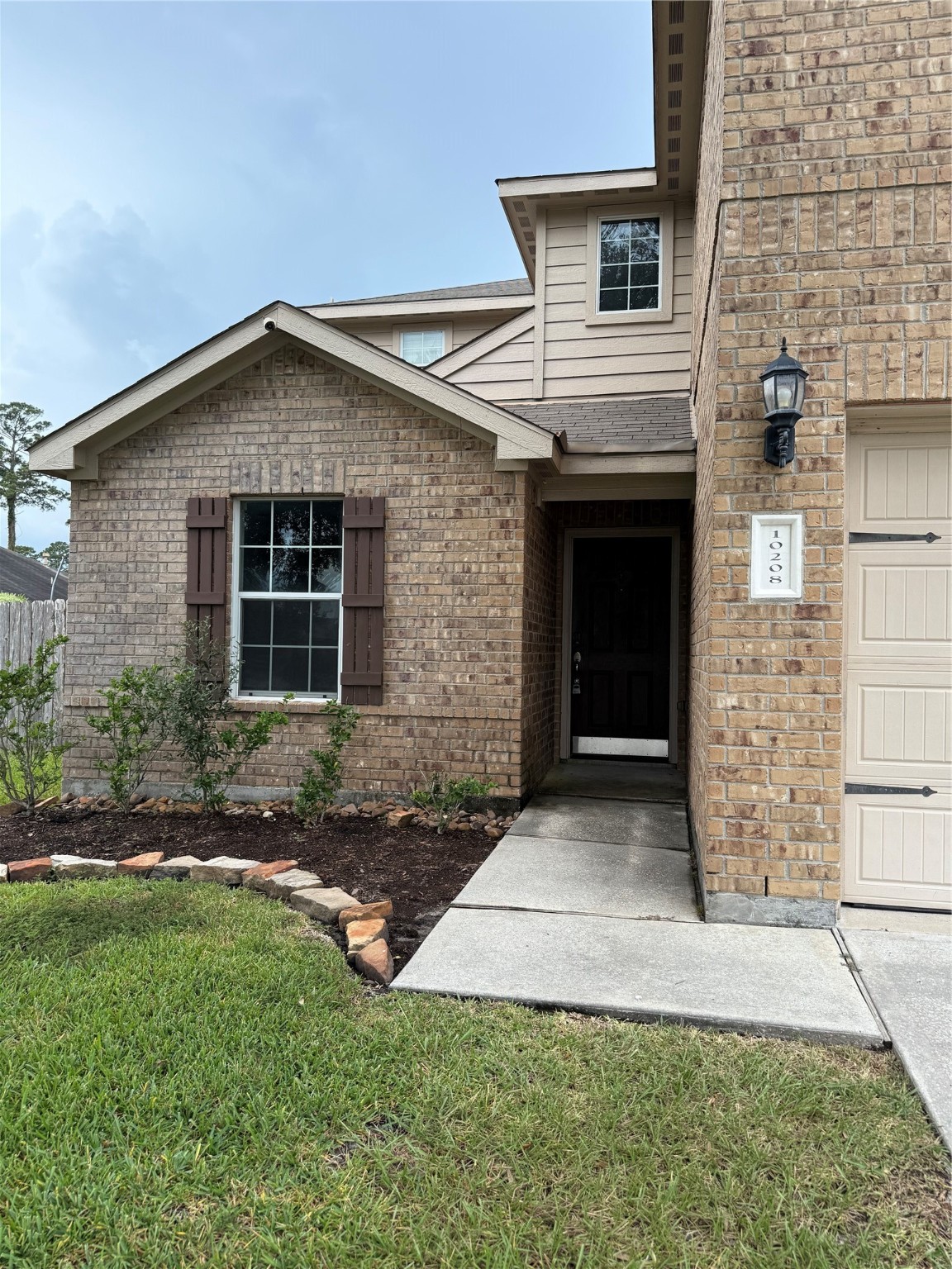 10208 Jewel Court Conroe, TX 77385 - Photo 2 of 23 a front view of a house with a yard