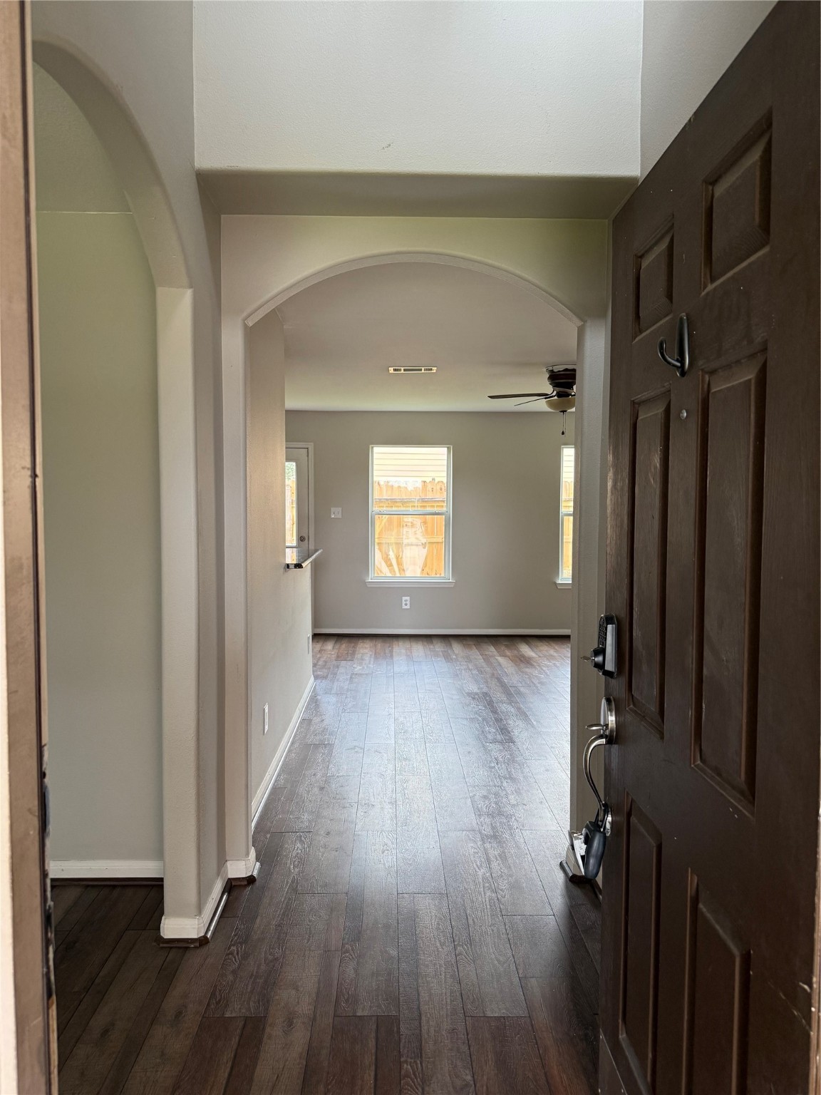 10208 Jewel Court Conroe, TX 77385 - Photo 3 of 23 a view of empty room with wooden floor and fan
