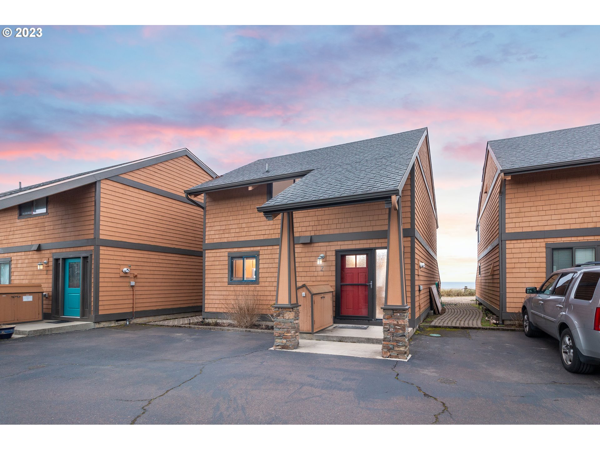 a backyard of a house with yard and outdoor seating