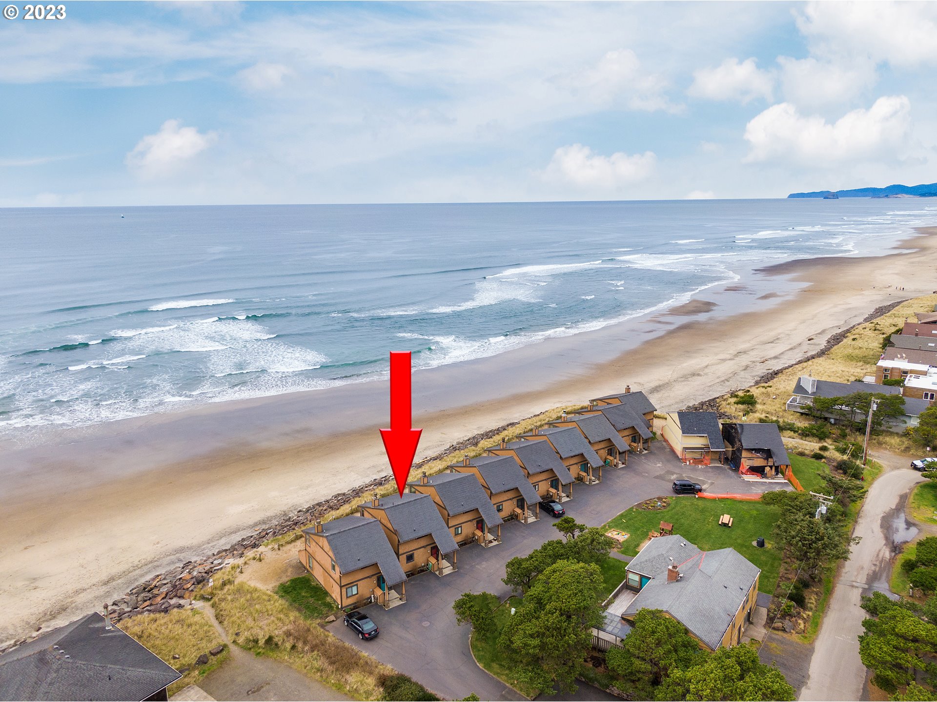 48060 Breakers Boulevard, Unit 2 Neskowin, OR 97149 - Photo 2 of 26 a view of an ocean and beach