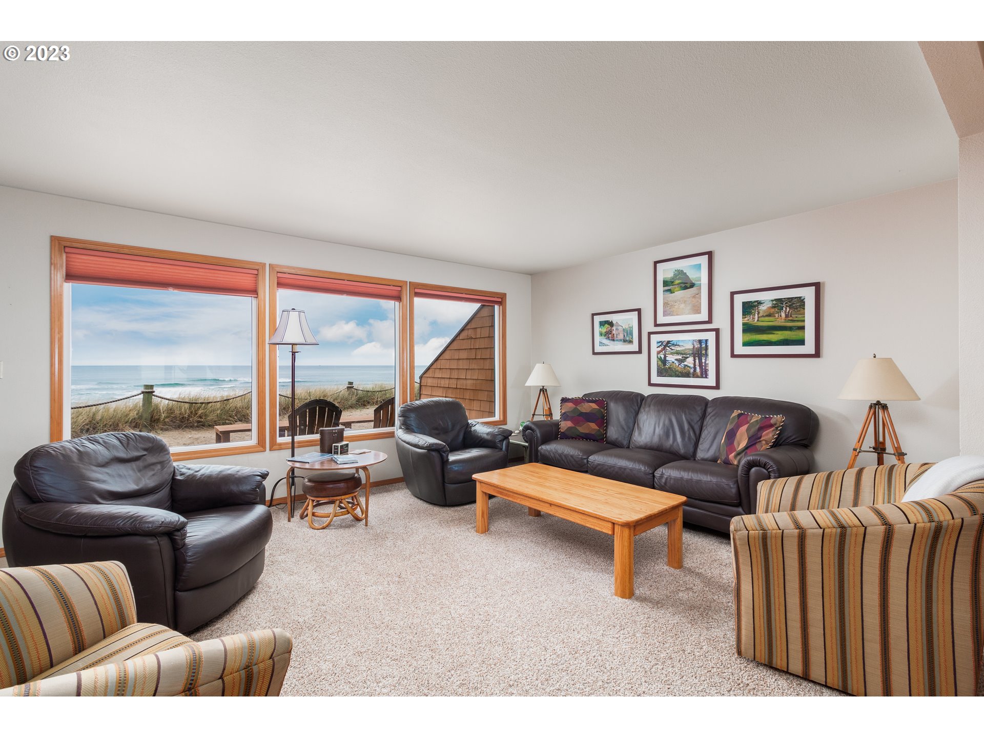 48060 Breakers Boulevard, Unit 2 Neskowin, OR 97149 - Photo 4 of 26 a living room with furniture and a large window