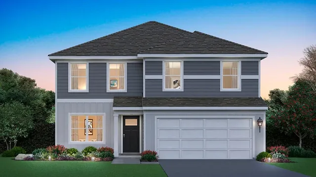 a front view of a house with a garden and plants