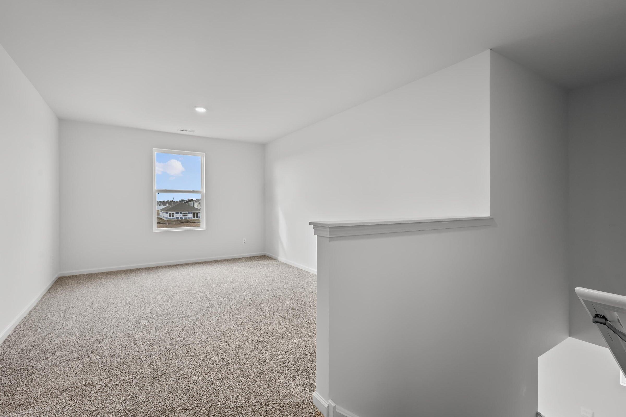 7770 West 106th Lane Crown Point, IN 46307 - Photo 17 of 25 a view of an empty room with a window
