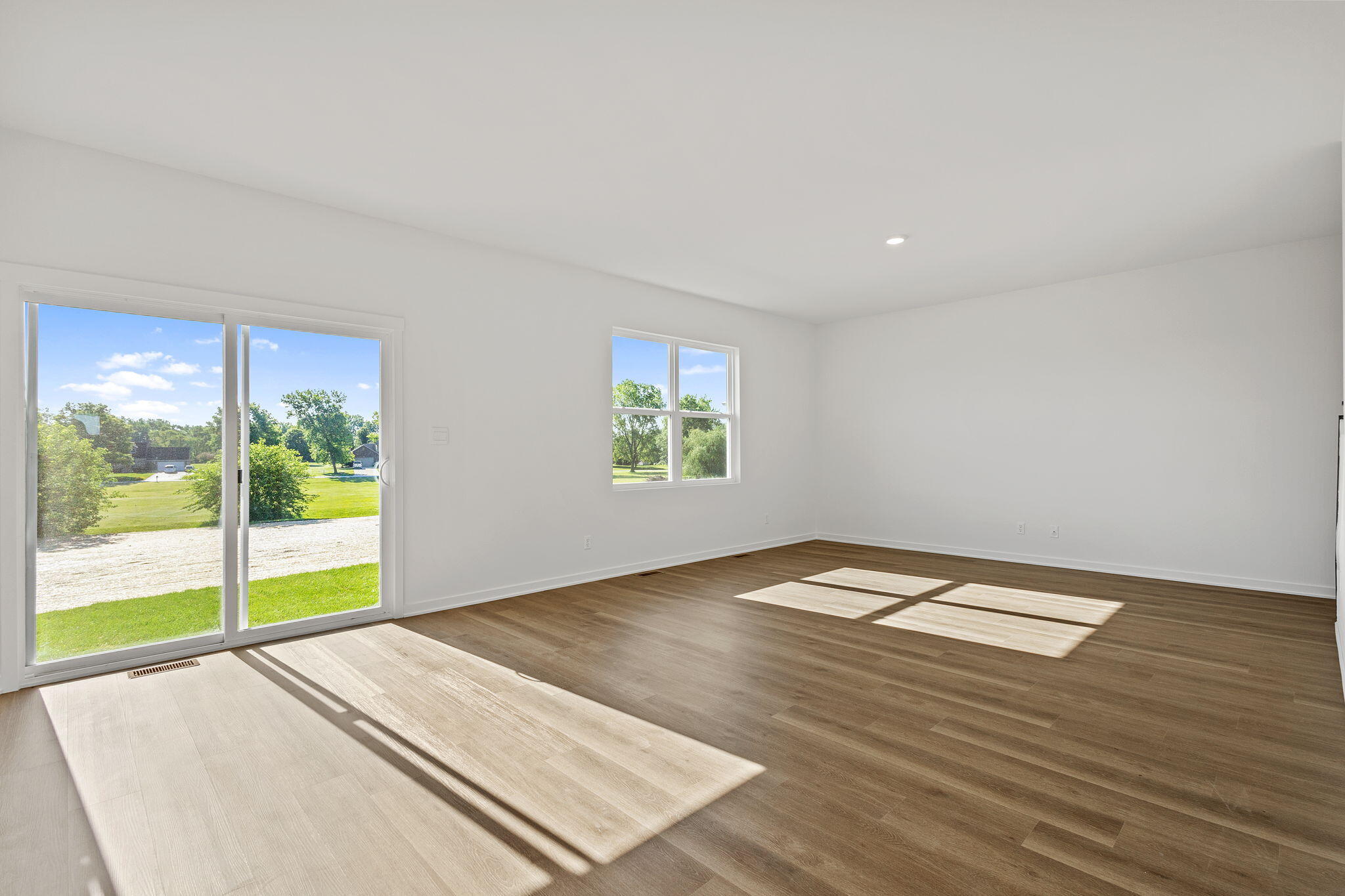 7770 West 106th Lane Crown Point, IN 46307 - Photo 8 of 25 wooden floor in an empty room with a window