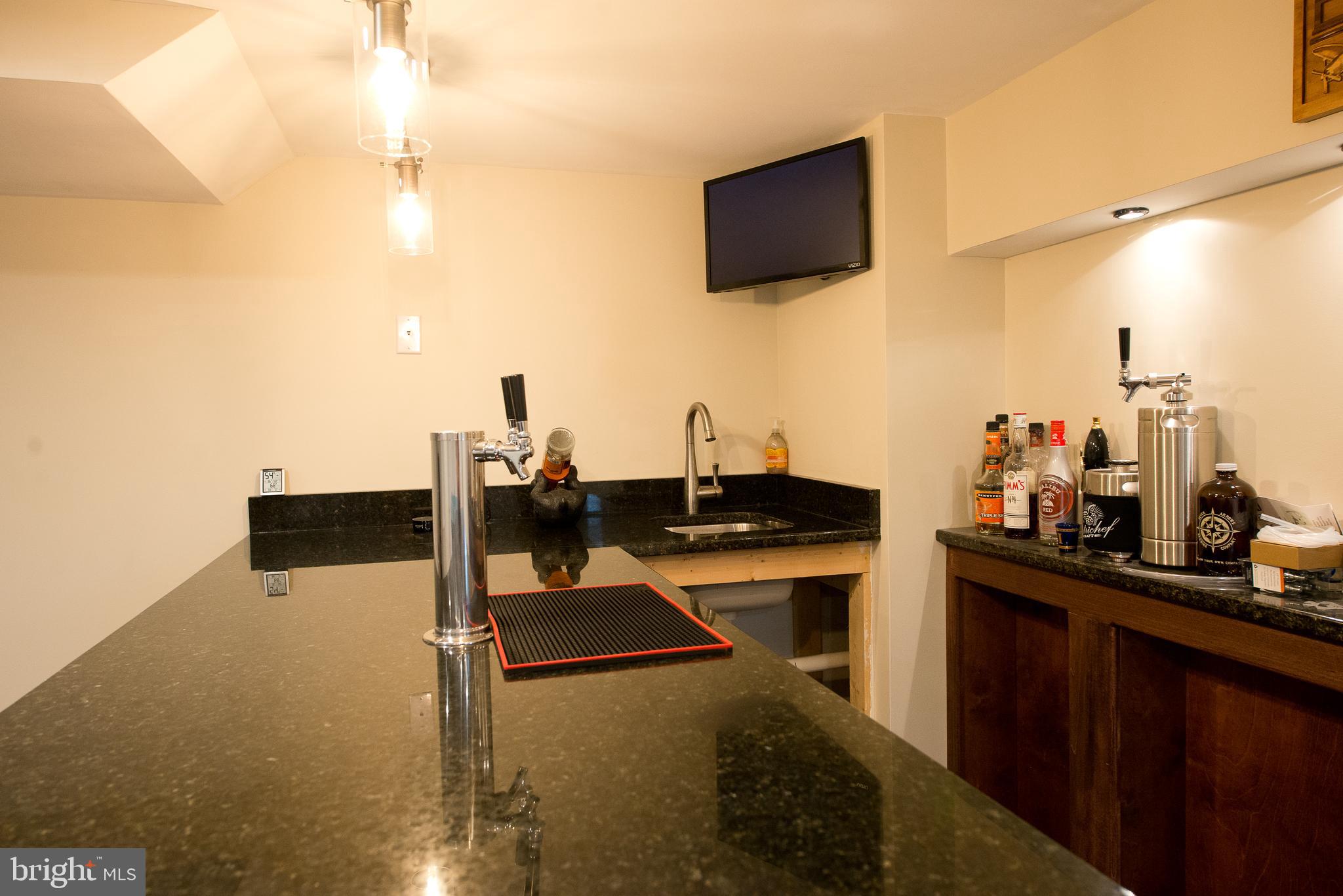 22261 Point Lookout Road Leonardtown, MD 20650 - Photo 22 of 33 Granite bar top with sink and keg tower