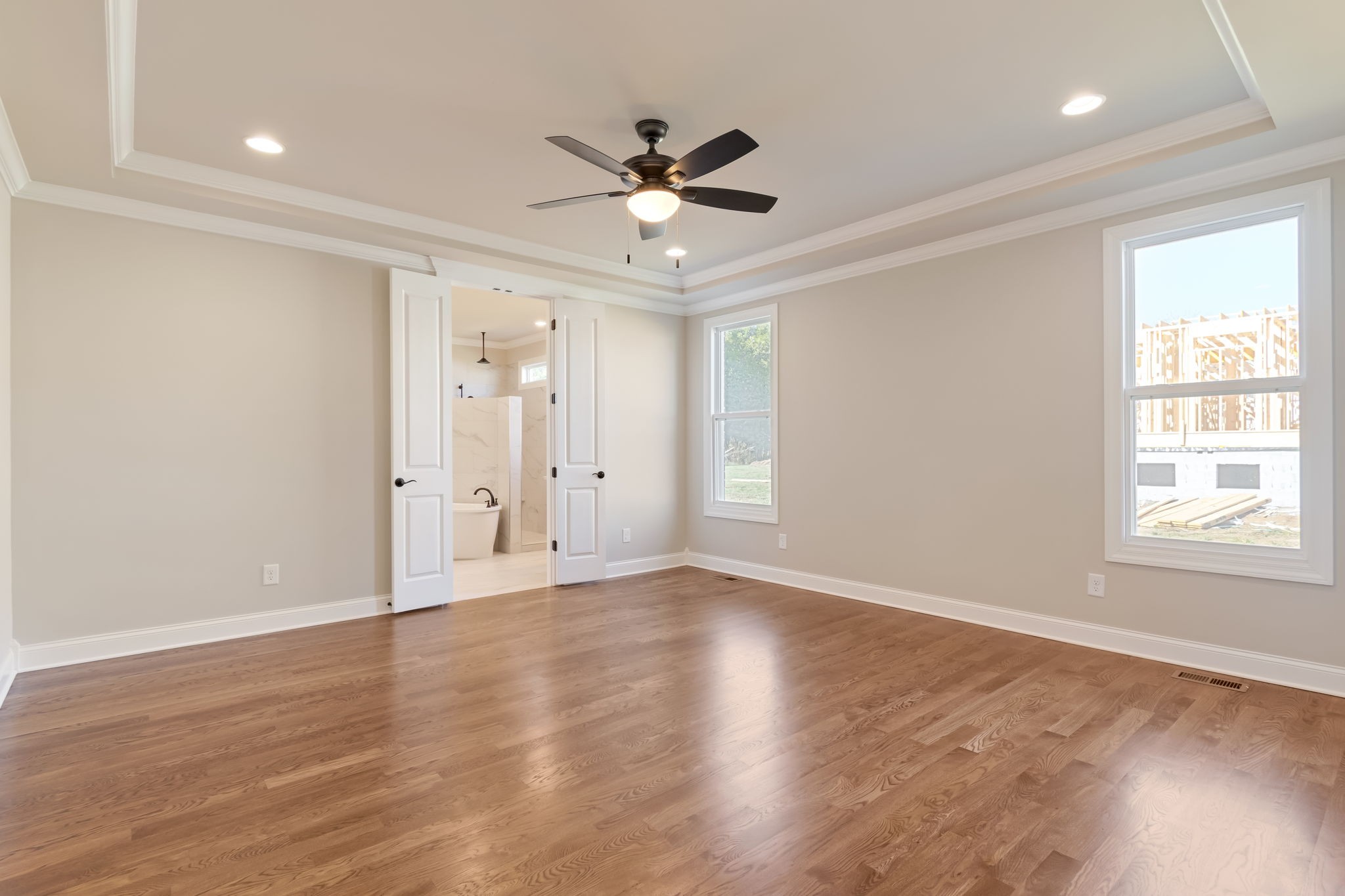 4111 Affiant Way Culleoka, TN 38451 - Photo 15 of 25 a view of an empty room with wooden floor and a window