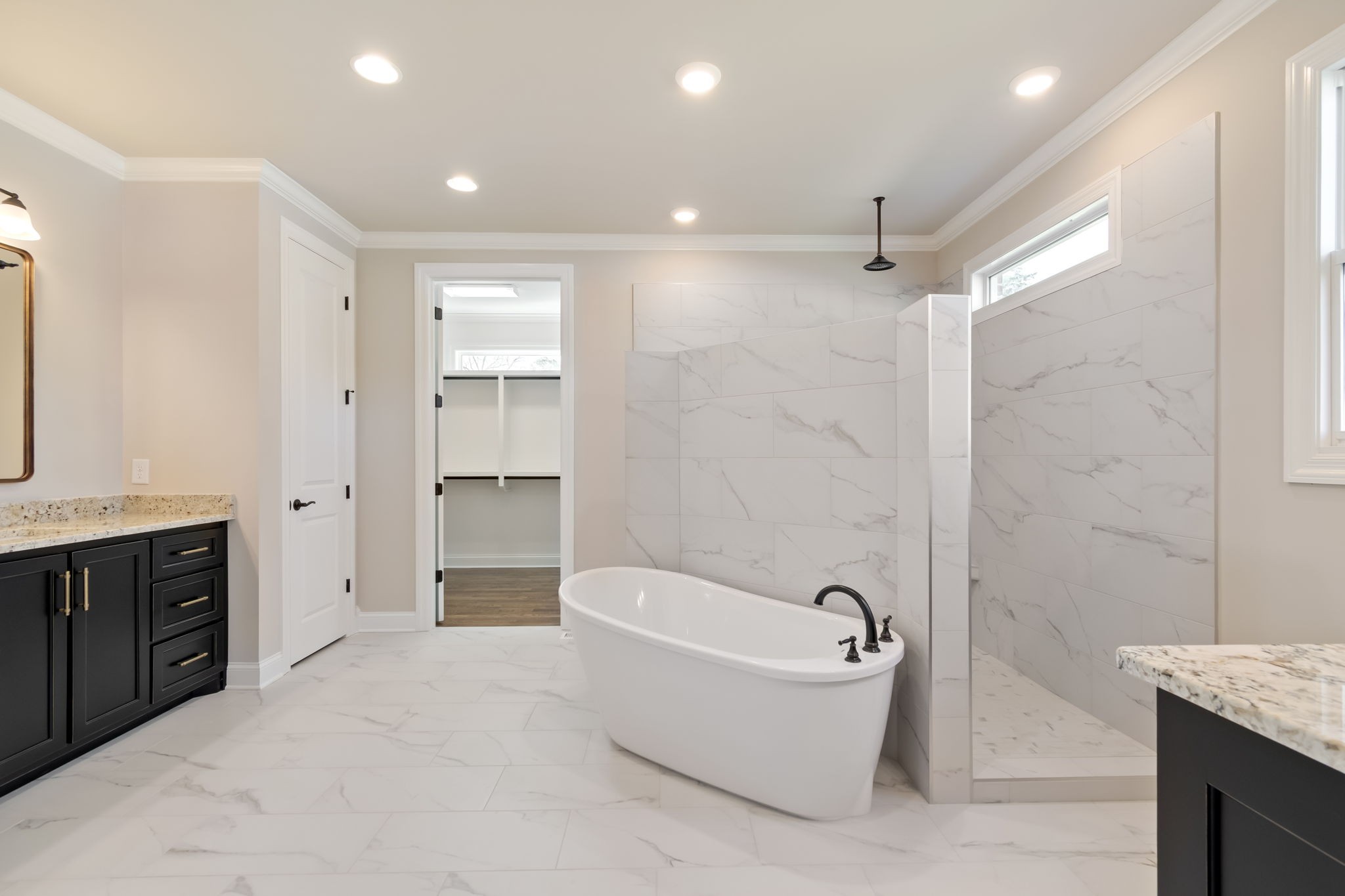 4111 Affiant Way Culleoka, TN 38451 - Photo 16 of 25 a spacious bathroom with a bathtub shower and a sink