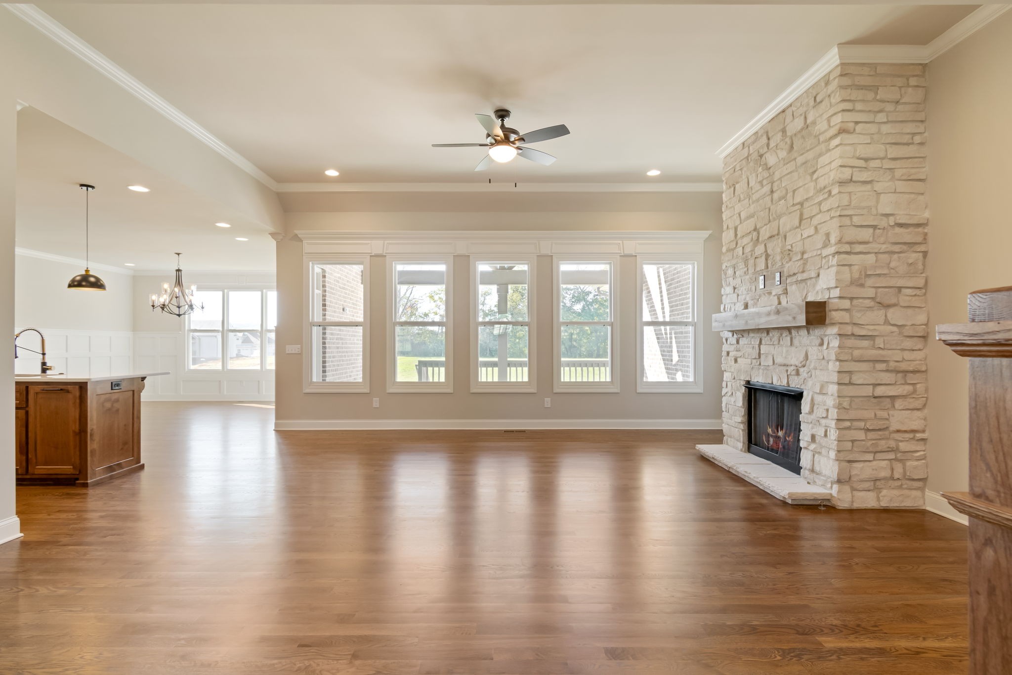 4111 Affiant Way Culleoka, TN 38451 - Photo 5 of 25 a view of an empty room with wooden floor and a fireplace