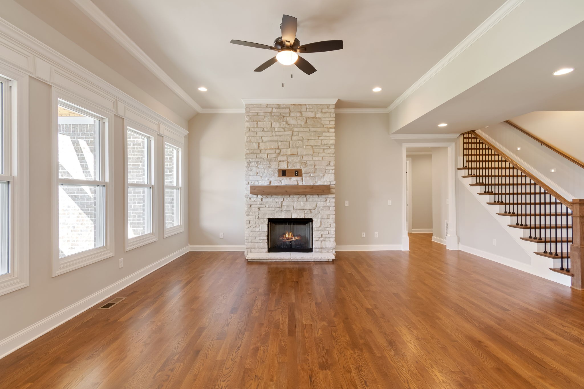 4111 Affiant Way Culleoka, TN 38451 - Photo 6 of 25 wooden floor fireplace and windows in an empty room