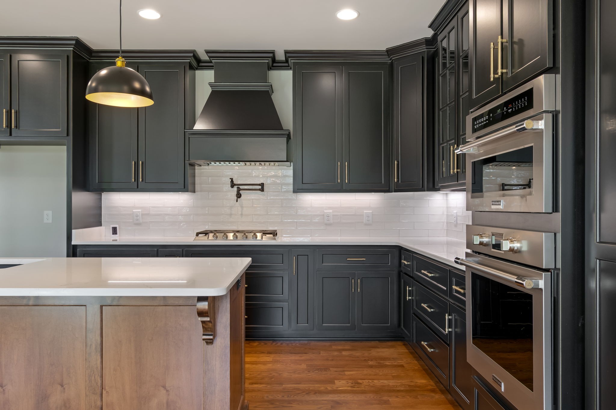 4111 Affiant Way Culleoka, TN 38451 - Photo 10 of 25 a kitchen with stainless steel appliances granite countertop a stove a sink and a refrigerator