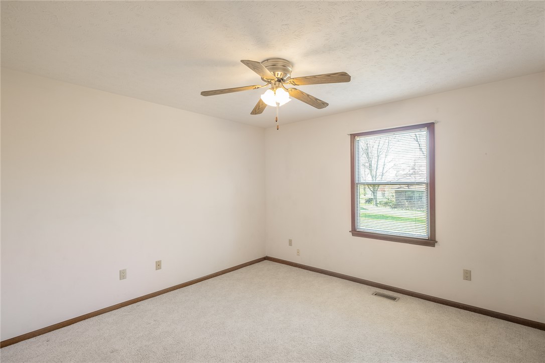 276 South Fairfield Road Bellbrook, OH 45305 - Photo 26 of 38 This airy bedroom offers a comfortable retreat with a window overlooking the verdant outdoors.