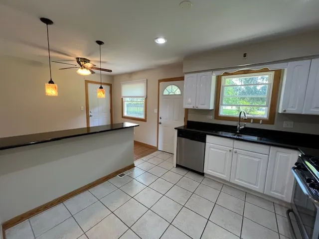 a kitchen with a sink and cabinets