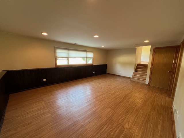 508 Creighton Lane Schaumburg, IL 60193 - Photo 12 of 22 a view of an empty room with wooden floor and a window