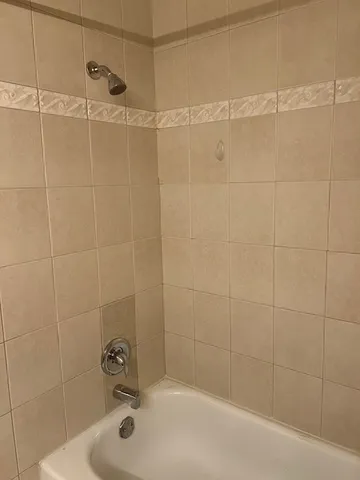 a bathroom with a shower and a bathtub