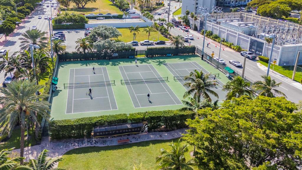 8855 Collins Avenue, Unit 2D Surfside, FL 33154 - Photo 18 of 25 an aerial view of a house with a swimming pool