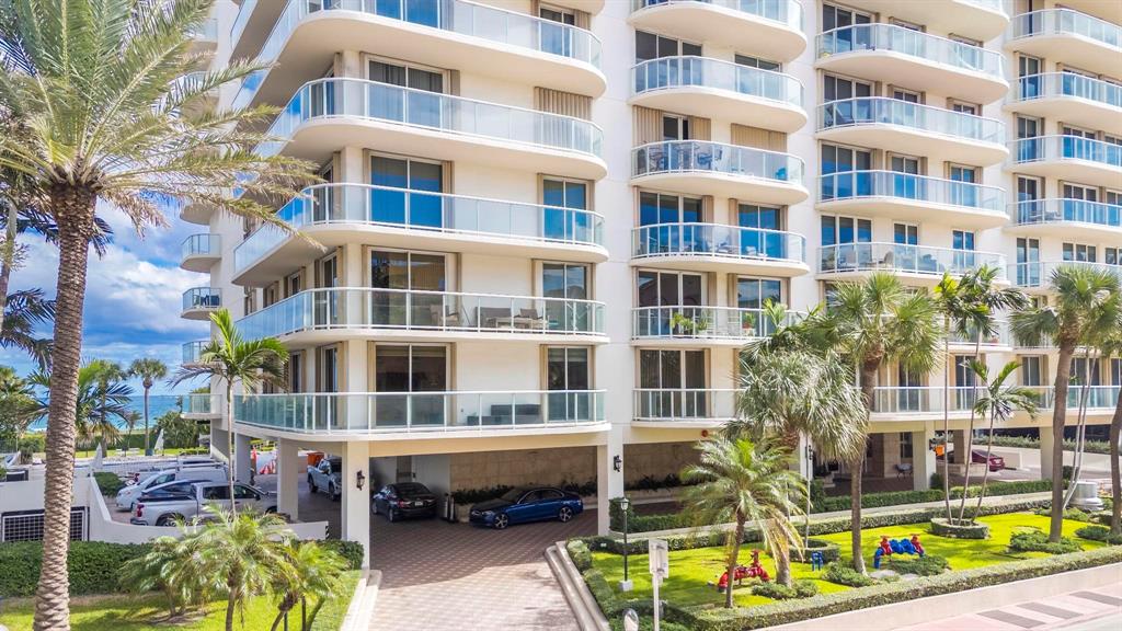 8855 Collins Avenue, Unit 2D Surfside, FL 33154 - Photo 22 of 25 a view of a building with a swimming pool