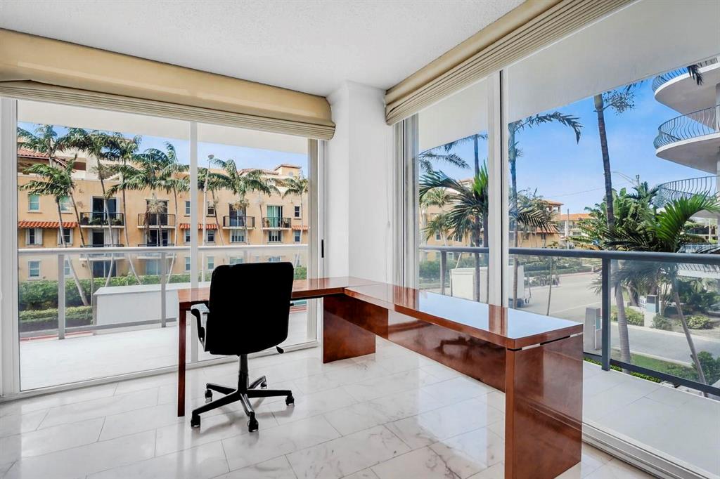 8855 Collins Avenue, Unit 2D Surfside, FL 33154 - Photo 4 of 25 a living room with furniture and a large window