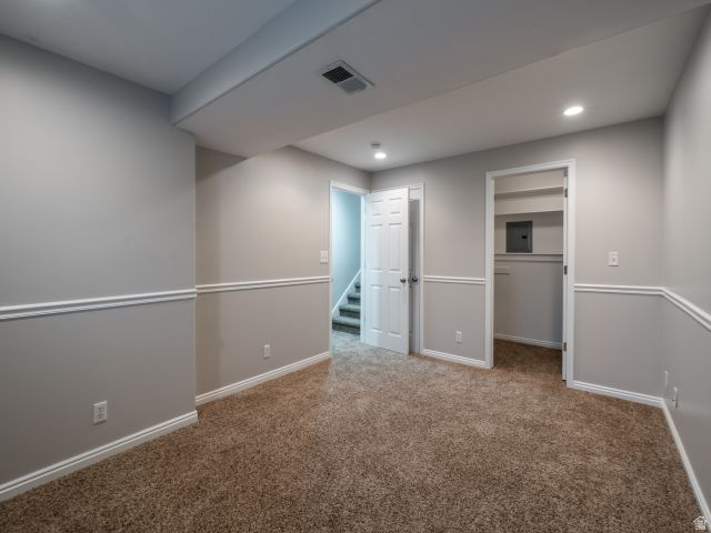 1446 West 1450 North Layton, UT 84041 - Photo 10 of 16 Spacious room featuring neutral carpeting, chair rail molding, recessed lighting, and white trim