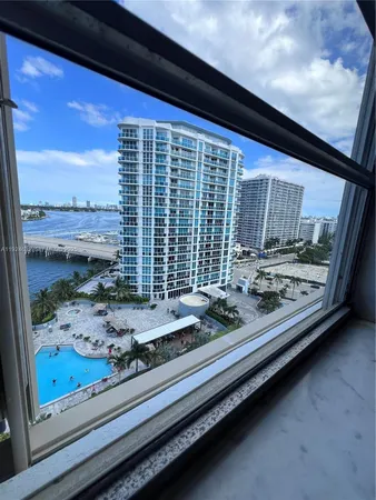 a view of a living room and window