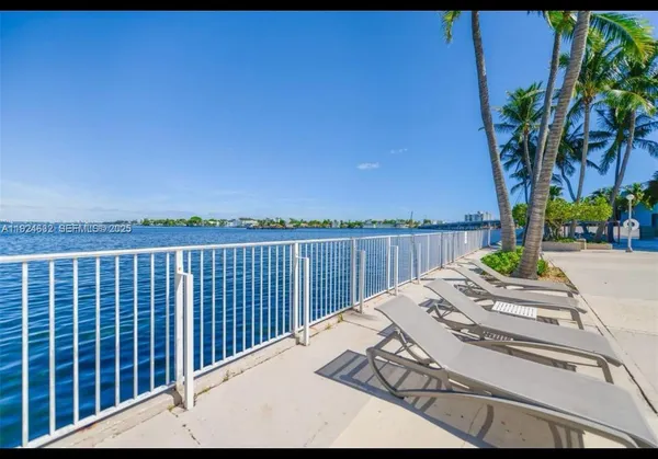 a view of balcony with wooden floor and outdoor seating