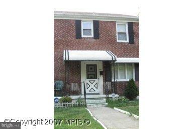443 South Wickham Road Baltimore, MD 21229 - Photo 1 of 9 a view of a brick house with a large windows